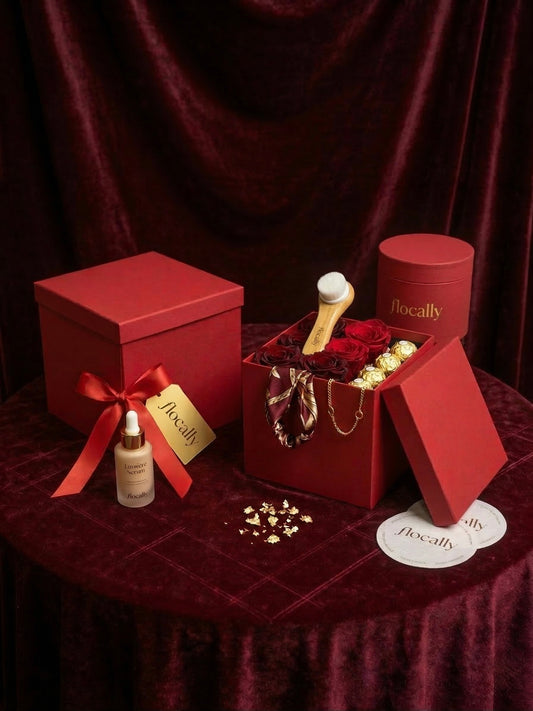 Red gift box with jewelry and a bottle on a dark red background