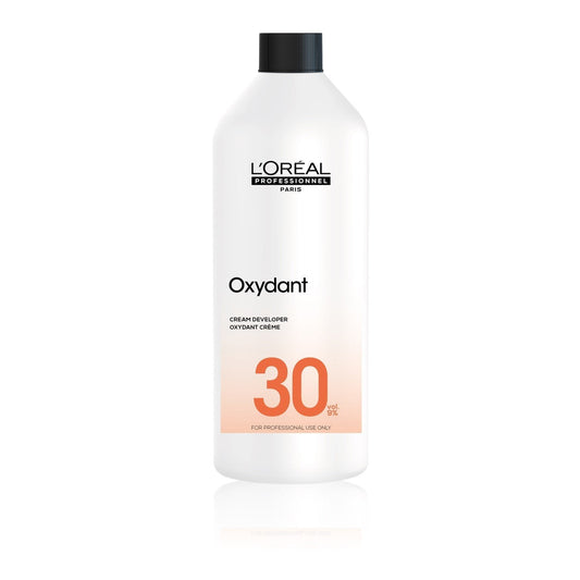 L'Oreal Oxydant cream developer bottle on a white background
